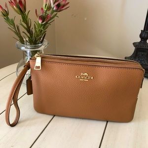 Coach light saddle clutch with gold hardware 2 zippers pockets